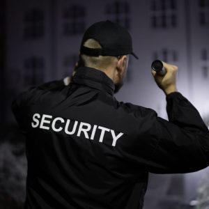 Security officer with flashlight